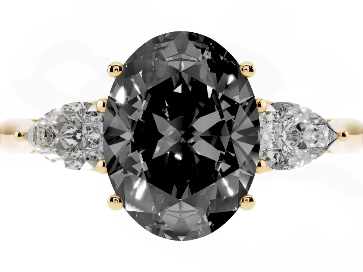 Fancy Black Three-Stone Oval Cut Brilliant Diamond Solitaire Ring with Tapered Band and Four-Prong Setting Yellow gold