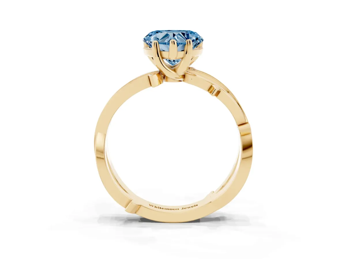 Fancy Blue Heart Cut Solitaire Twist Band with Pavé Accents and Four-Prong Setting Yellow gold