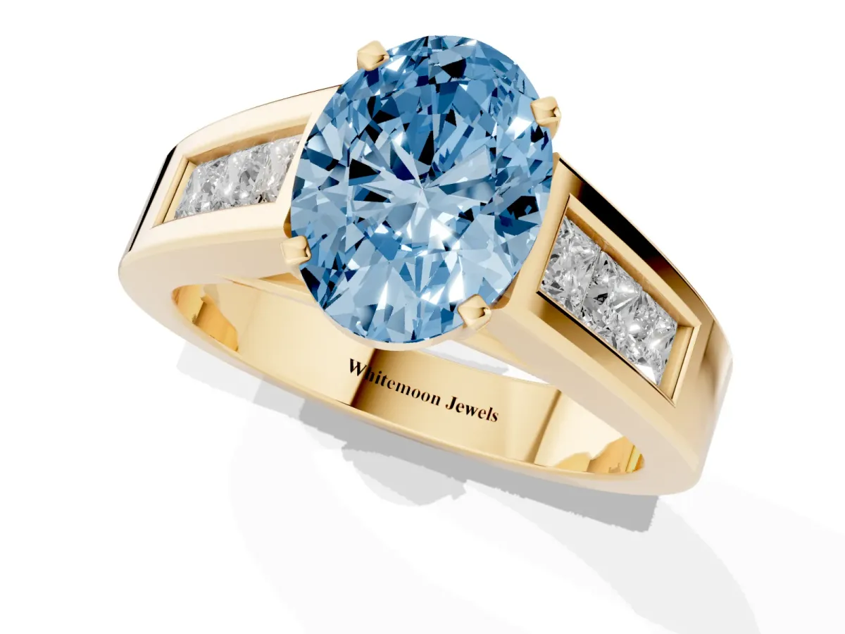 Fancy Blue Oval Cut Cut Channel Set Solitaire Ring with Four-Prong Setting Yellow gold