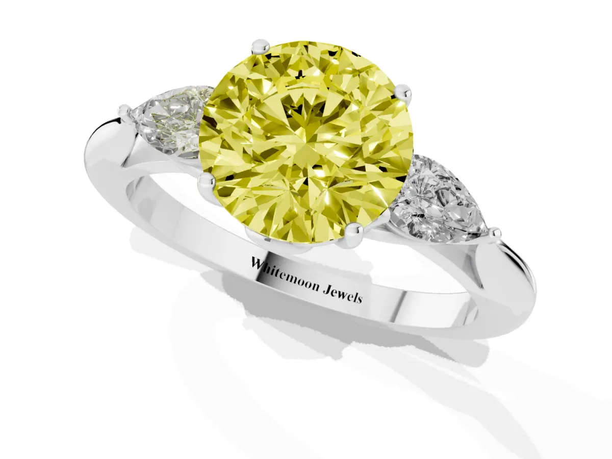 Fancy Yellow Three-Stone Round Cut Diamond Ring with Pear Side Stones in Four-Prong Setting Platinum