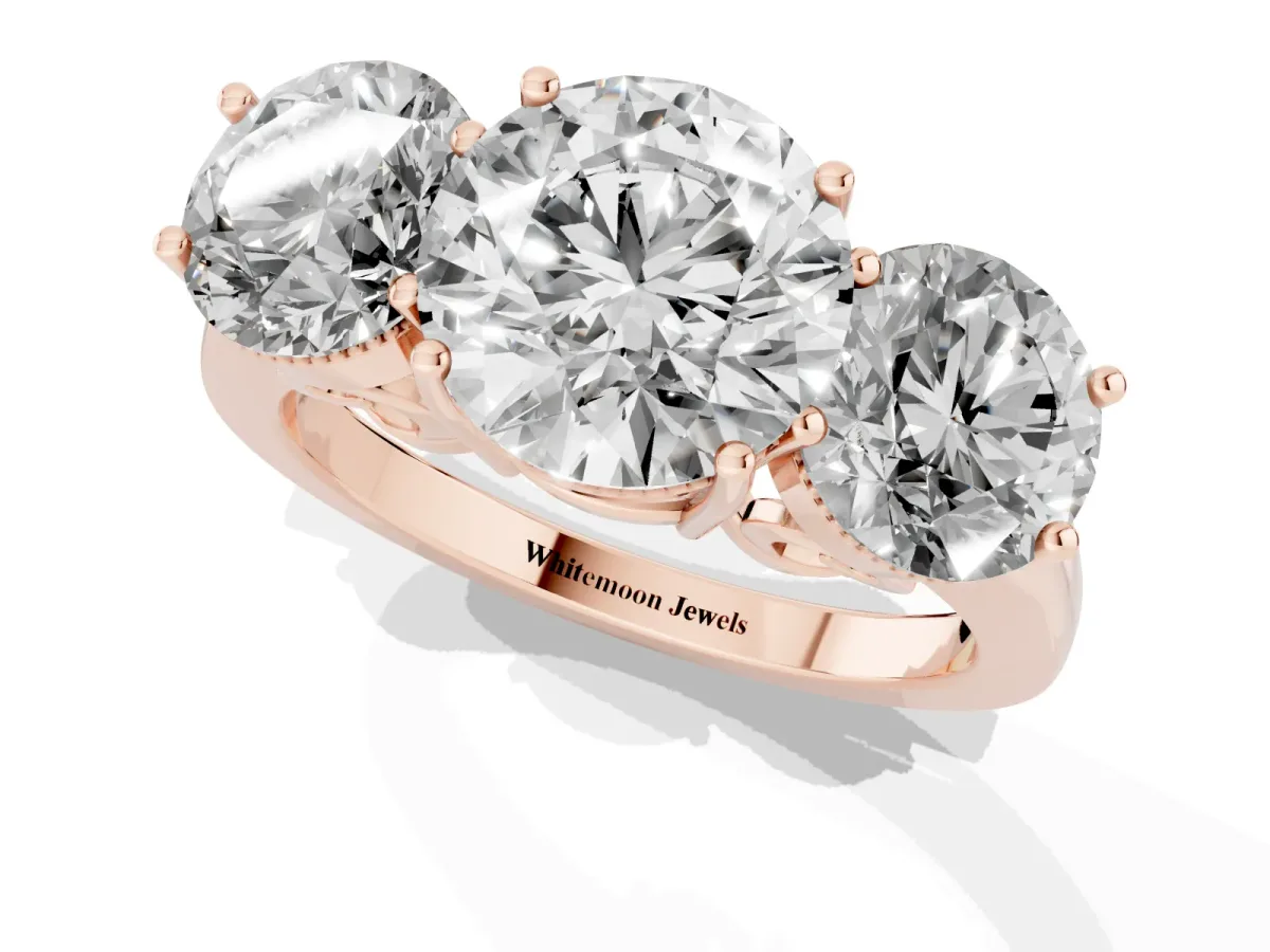 Three-Stone Round Cut Diamond Engagement Ring with Prong Setting on a Classic Band Rose gold