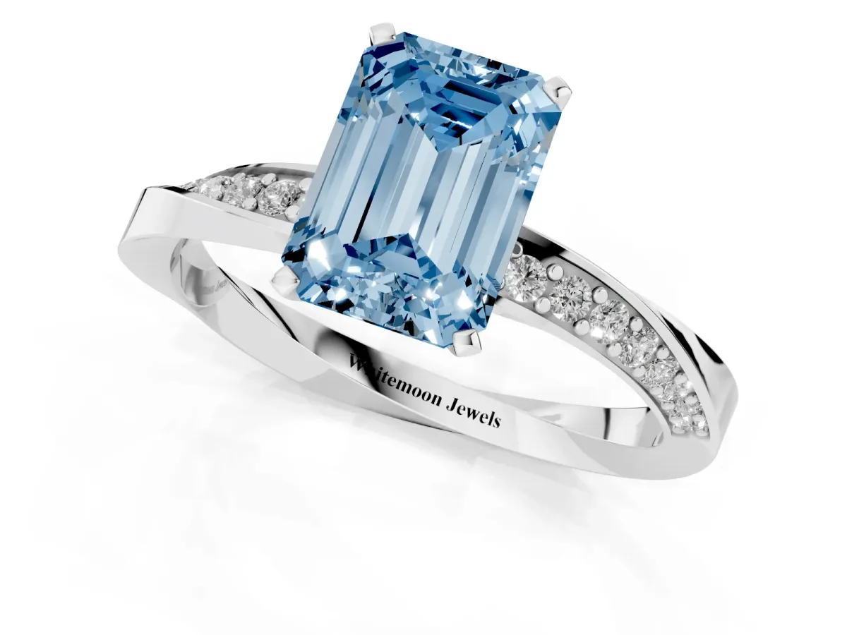 Fancy Blue Emerald Cut Diamond Engagement Ring with Side Stone Accents and Four-Prong Setting Silver