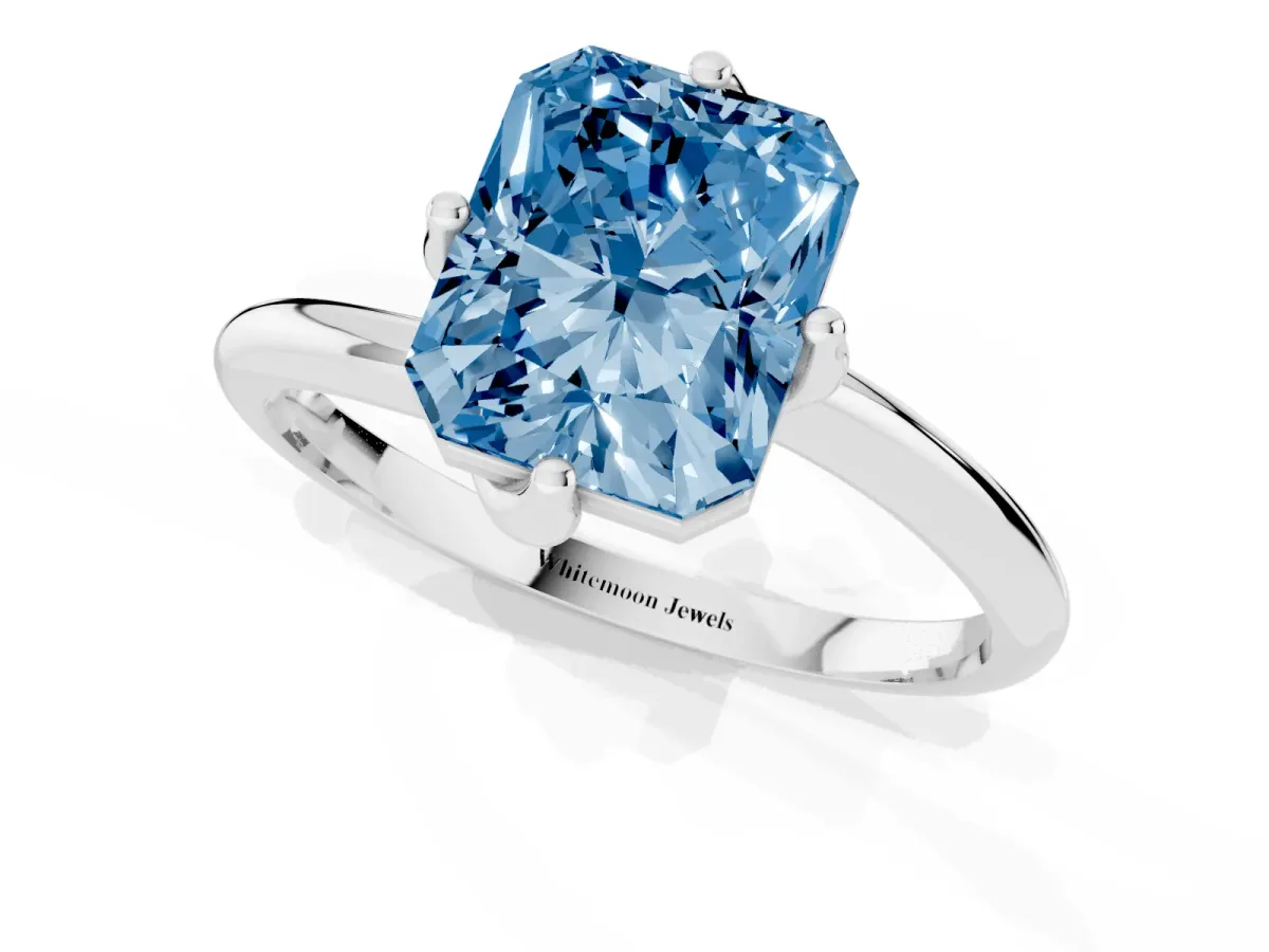 Fancy Blue Radiant Cut Diamond Solitaire Engagement Ring with Four-Prong Setting and Classic Band Silver