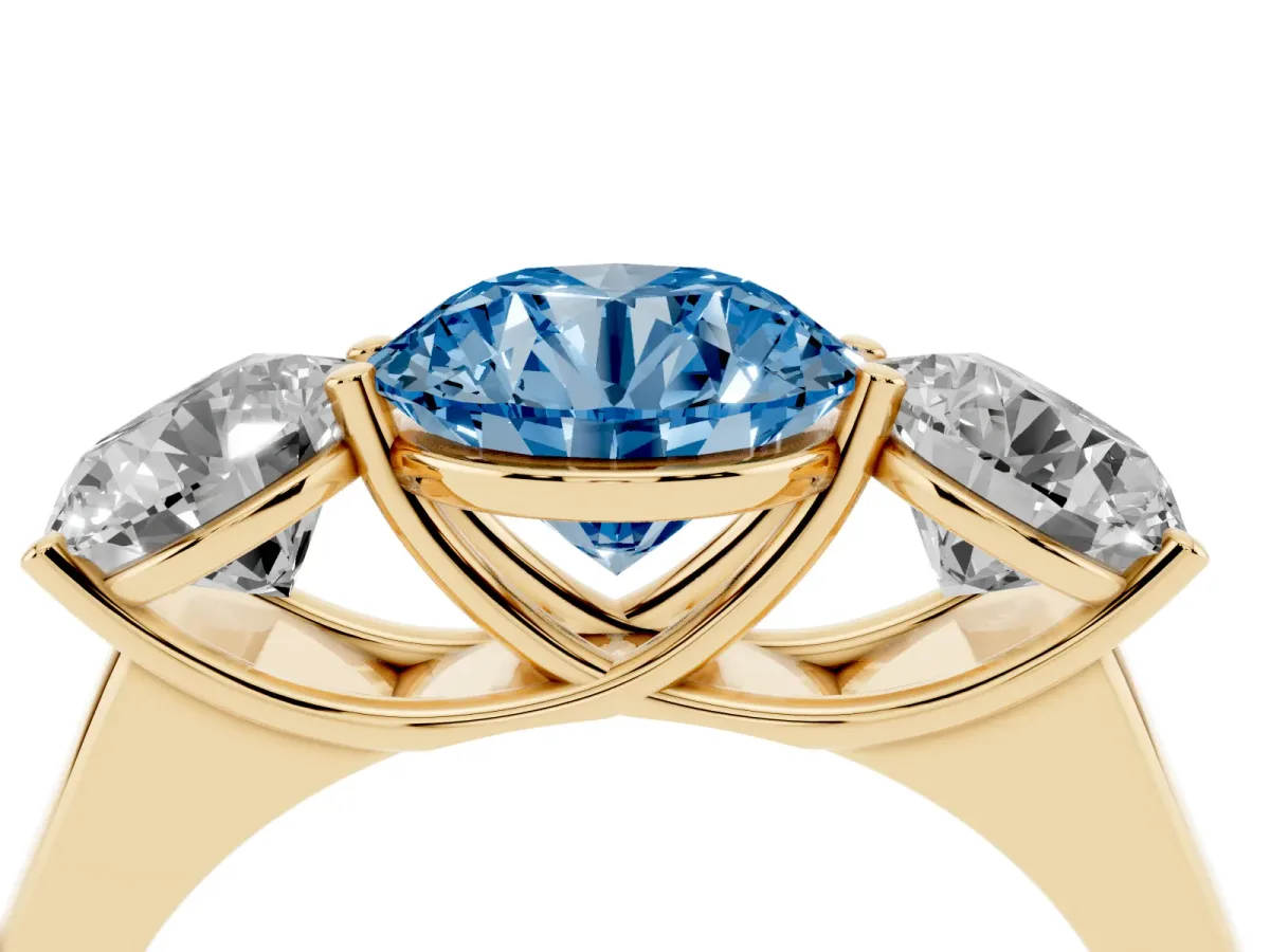 Fancy Blue Round Cut Three-Stone Diamond Ring with Prong Setting on a Classic Band Yellow gold