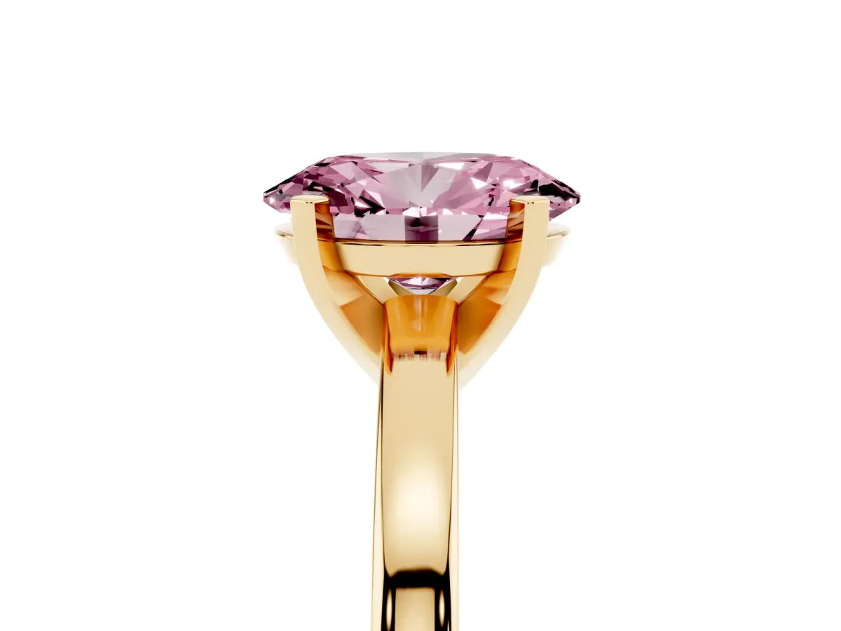 Fancy Pink Oval Cut Solitaire Diamond Engagement Ring with Four-Prong Setting on a Classic Band Yellow gold