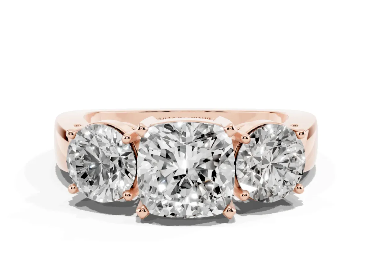 Three-Stone Cushion Cut Diamond Ring with Round Side Stones, Classic Band, and Four-Prong Setting Rose gold
