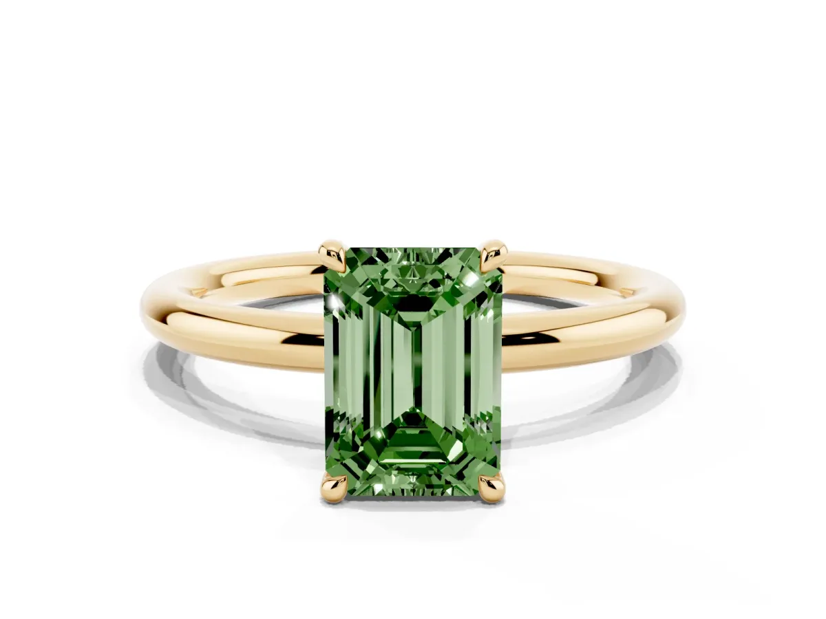 Fancy Green Emerald Cut Diamond Solitaire Ring with Thin Band and Four-Prong Setting Yellow gold