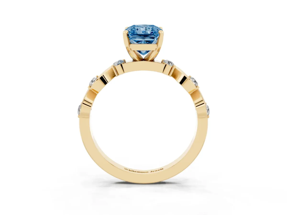 Fancy Blue Radiant Cut Diamond Solitaire Twisted Band with Round Accents and Prong Setting Yellow gold