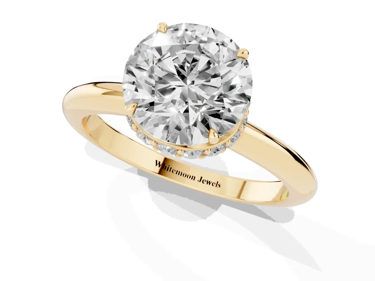 Round Cut Brilliant Solitaire Engagement Ring with Six-Prong Setting and Classic Band Yellow gold