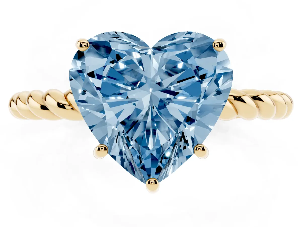 Fancy Blue Heart Cut Solitaire Twist Band Ring with Four-Prong Setting Yellow gold