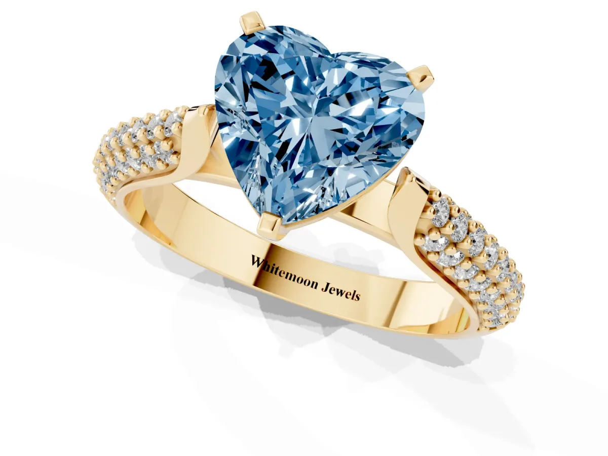 Fancy Blue Heart Cut Diamond Solitaire Engagement Ring with Multi-Row Round Pavé Band and Prong Setting Yellow gold