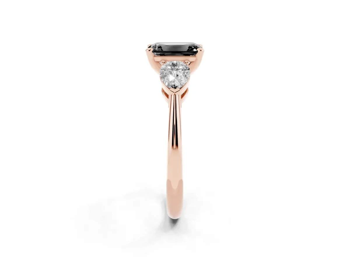 Fancy Black Three-Stone Emerald Cut Diamond Ring with Pear Side Stones and Four-Prong Setting Rose gold