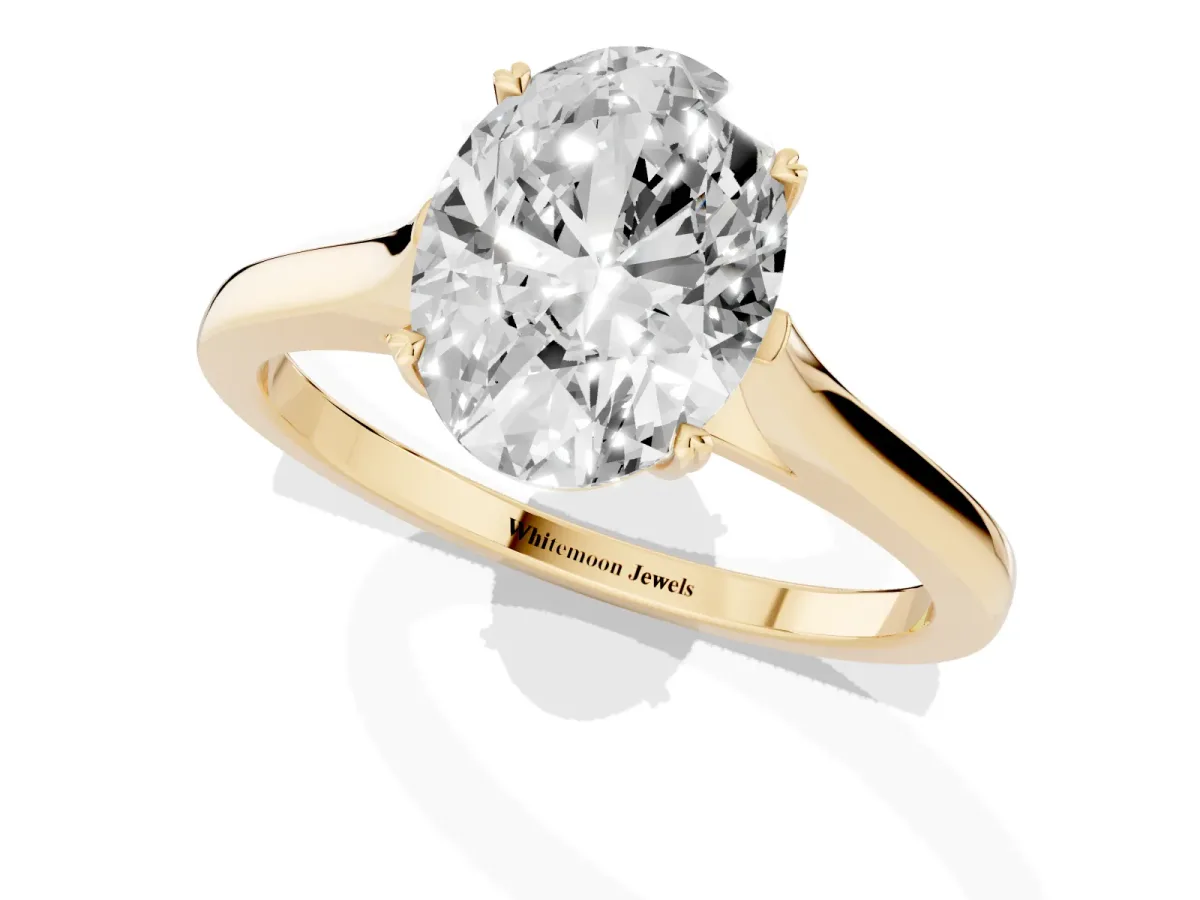 Oval Cut Solitaire Heart Prong Engagement Ring with Tapered Band Yellow gold