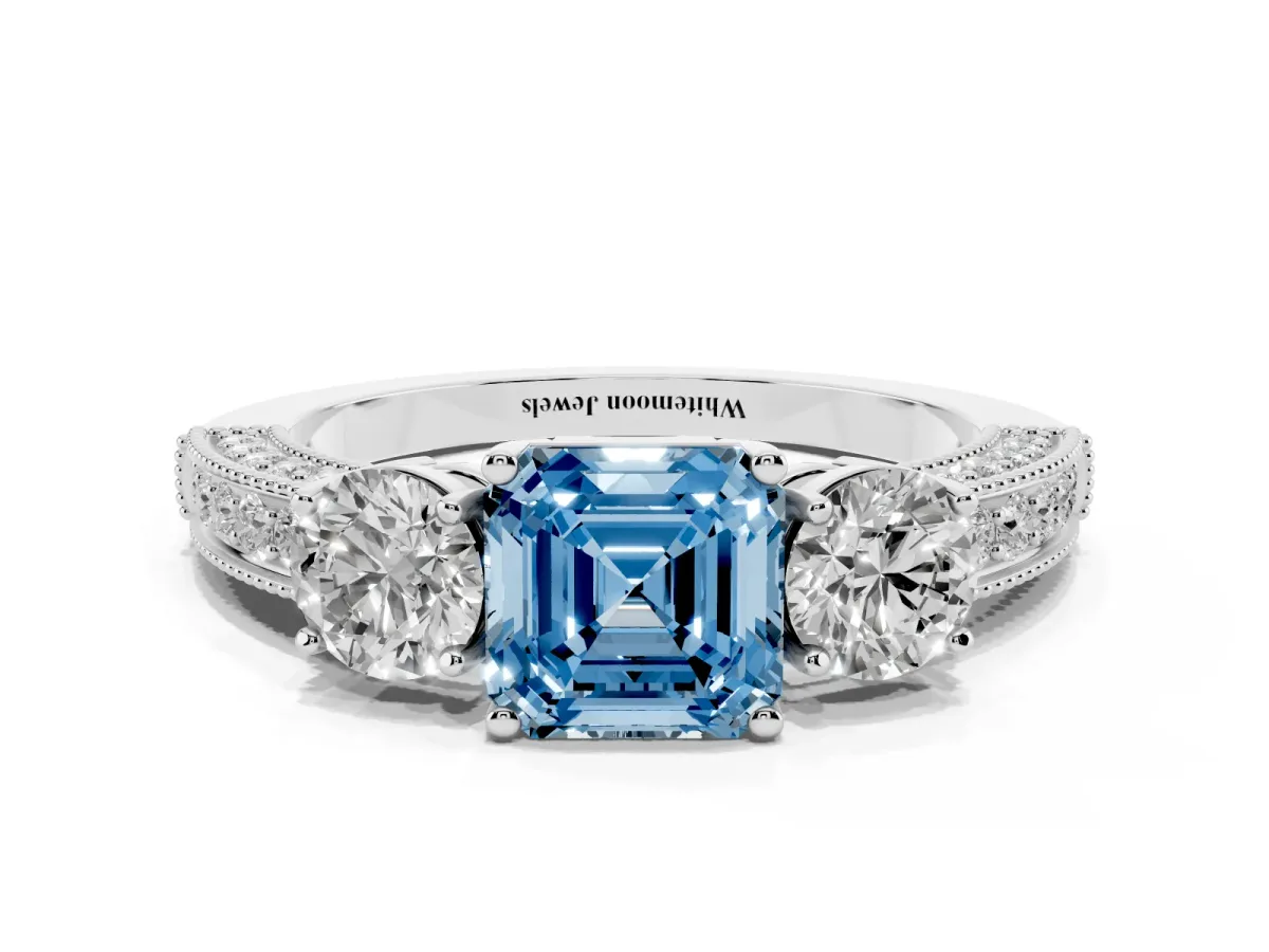 Fancy Blue Asscher Cut Three-Stone Diamond Ring with Pavé Band and Four-Prong Setting Silver
