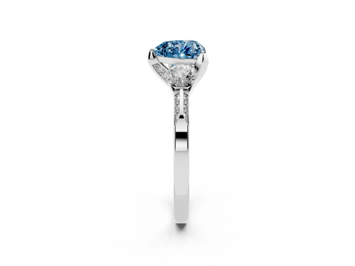 Fancy Blue Heart Cut Brilliant Three-Stone Diamond Ring with Pavé Band and Four-Prong Setting Platinum