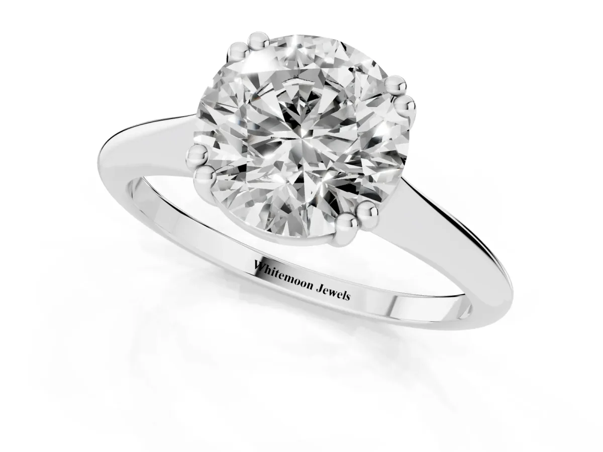 Round Cut Solitaire Diamond Ring with Six-Prong Setting and Classic Band Silver
