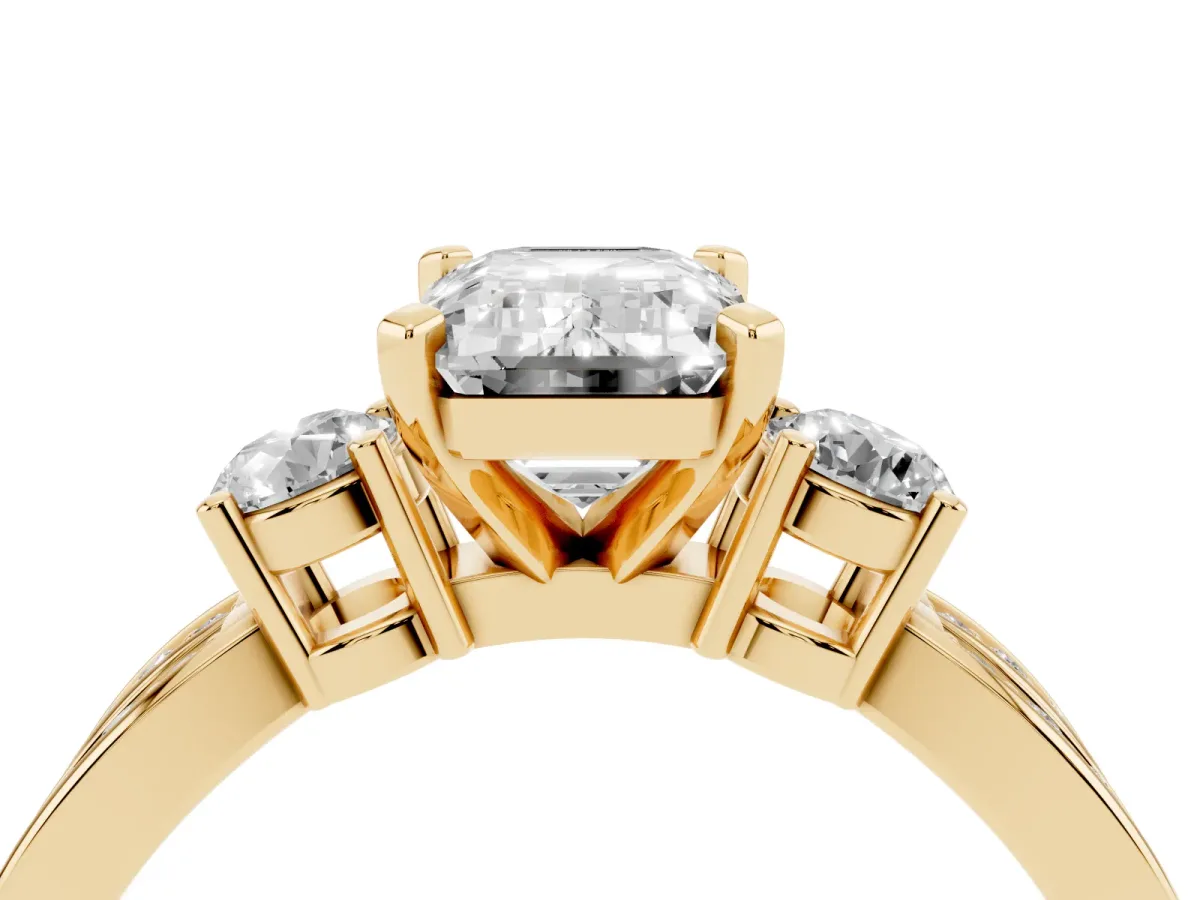 Three-Stone Emerald Cut Cut Diamond Twist Band with Prong Setting Yellow gold