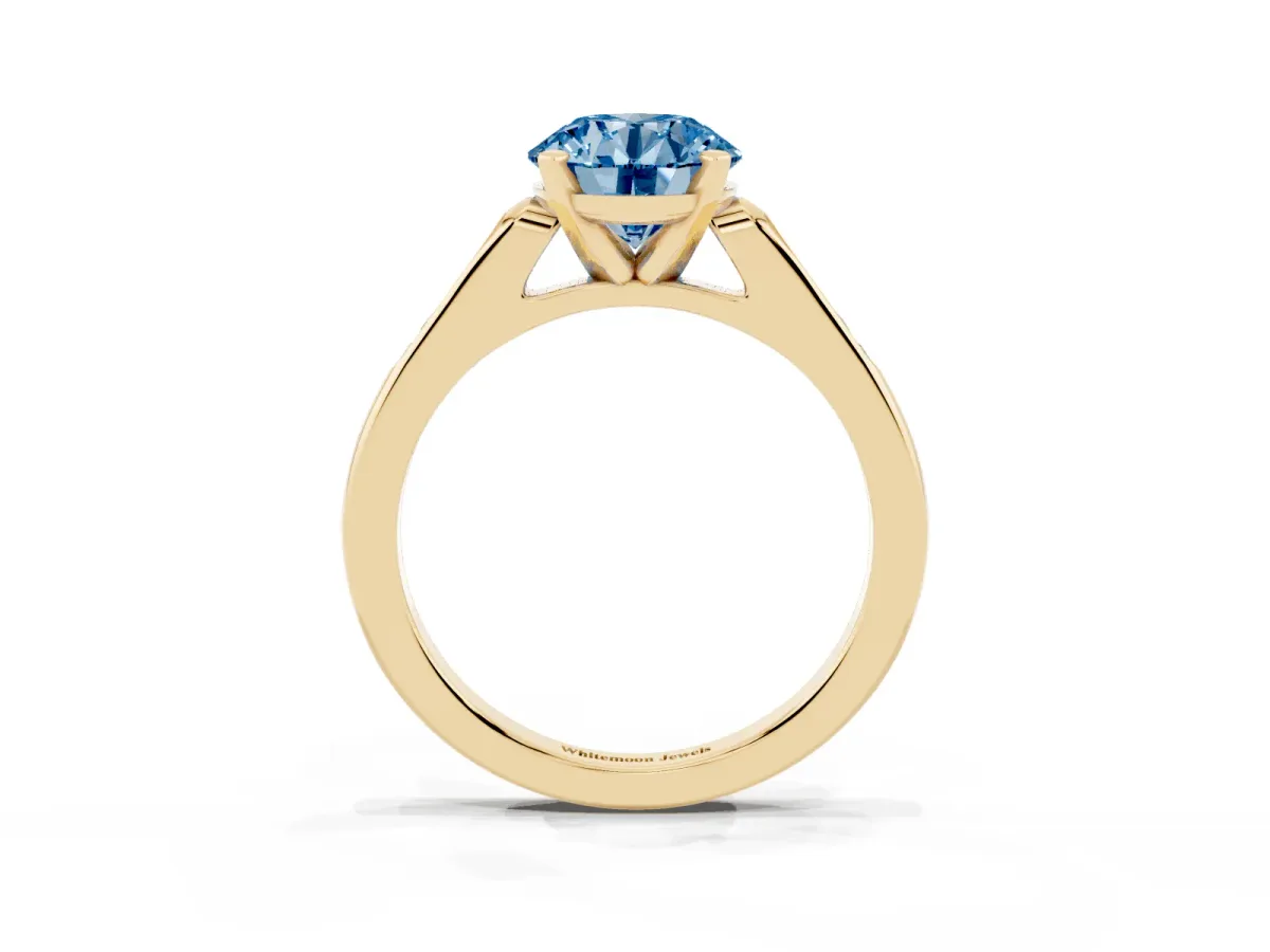 Fancy Blue Round Cut Diamond Solitaire Ring with Channel Set Round Band and Prong Setting Yellow gold