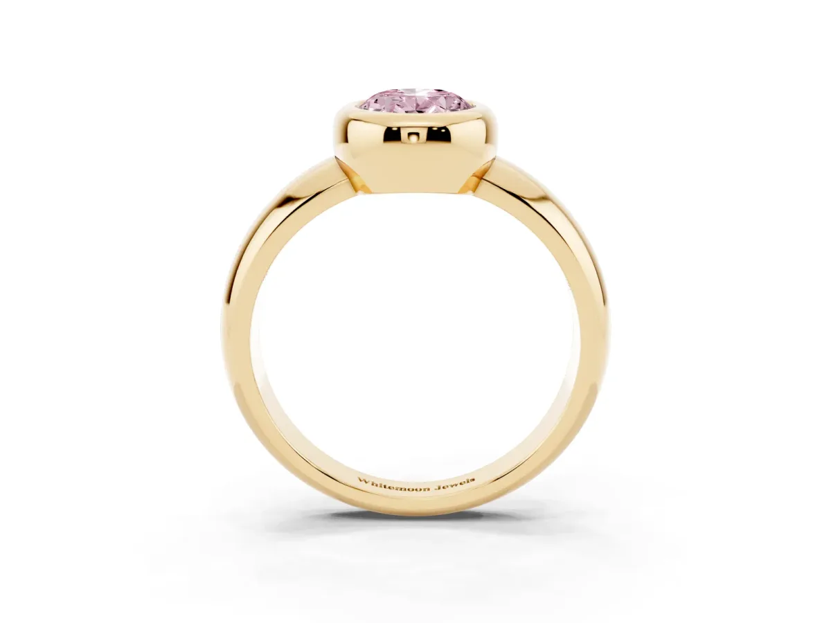Fancy Pink Bezel Set Oval Cut Solitaire Ring with Wide Band Yellow gold
