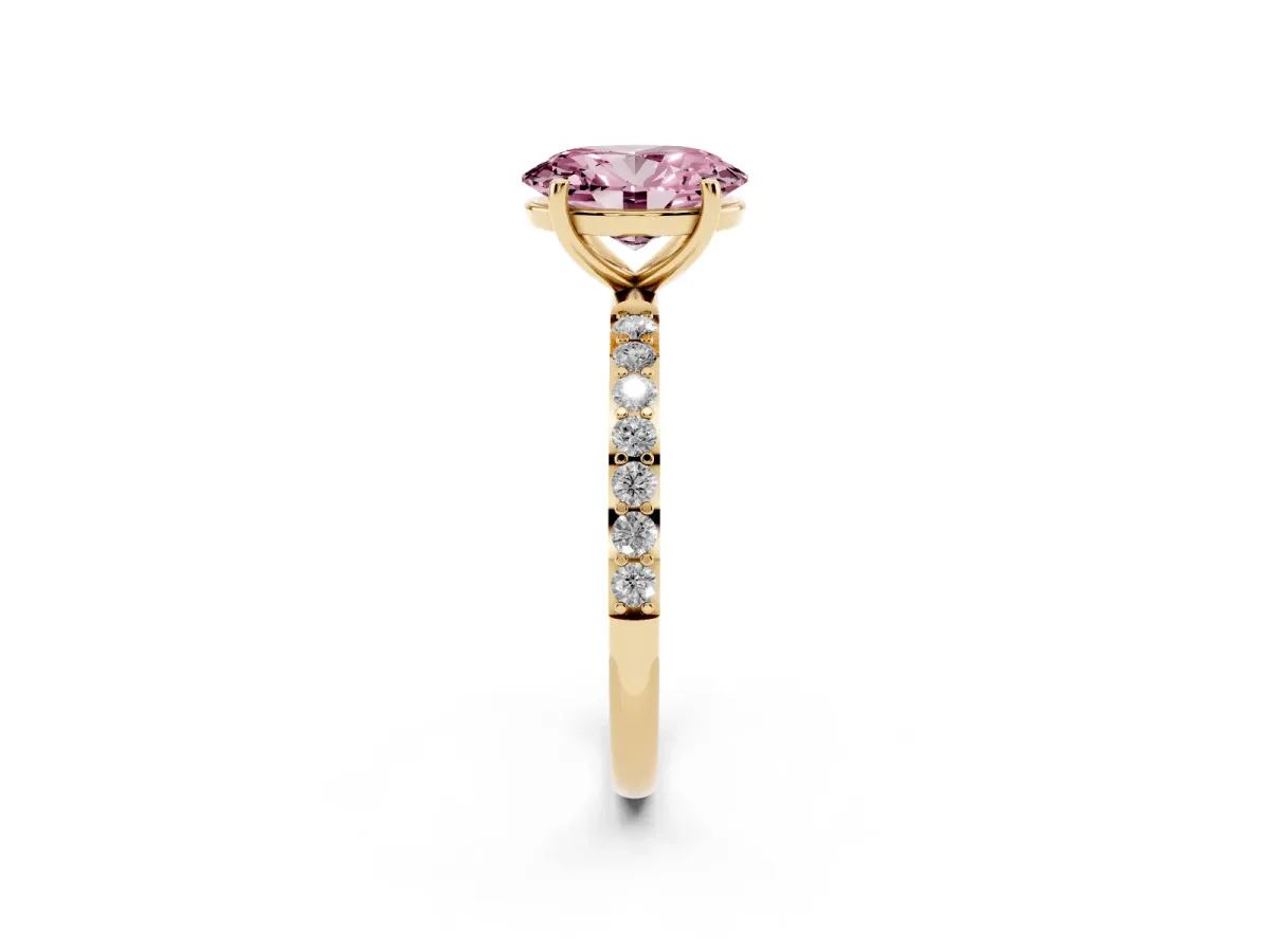 Fancy Pink Oval Cut Diamond Solitaire Ring with Round Pavé Shoulders and Prong Setting Yellow gold