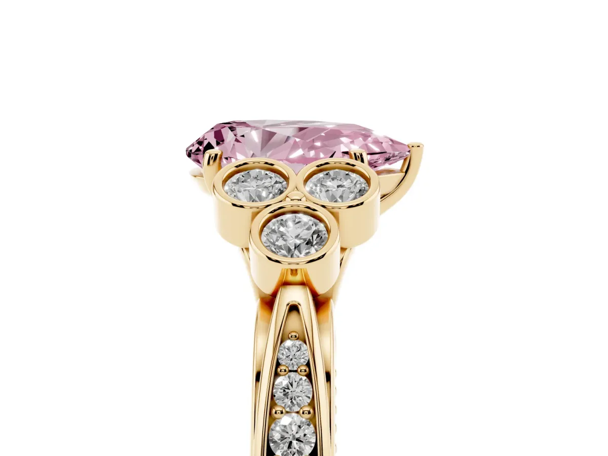 Fancy Pink Pear Cut Cut Diamond Engagement Ring with Bezel Set Round Side Stones and Prong Setting Yellow gold