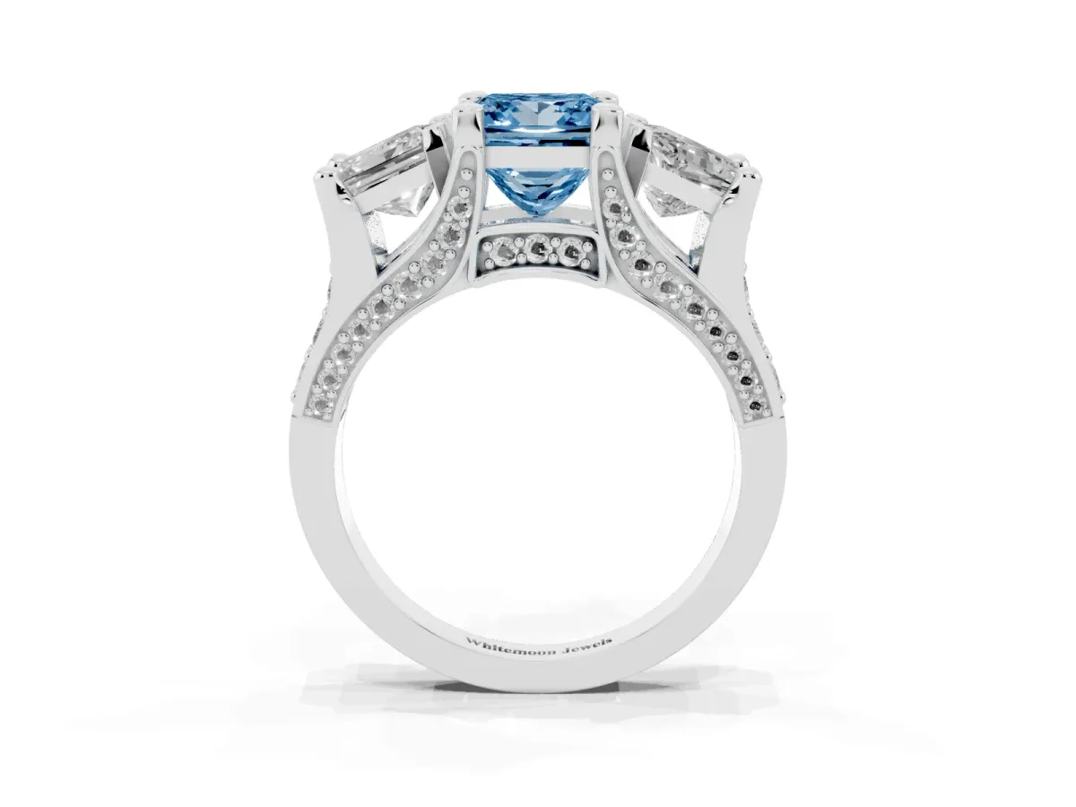 Fancy Blue Princess Cut Diamond Three-Stone Ring with Channel Set Band and Four-Prong Setting Silver