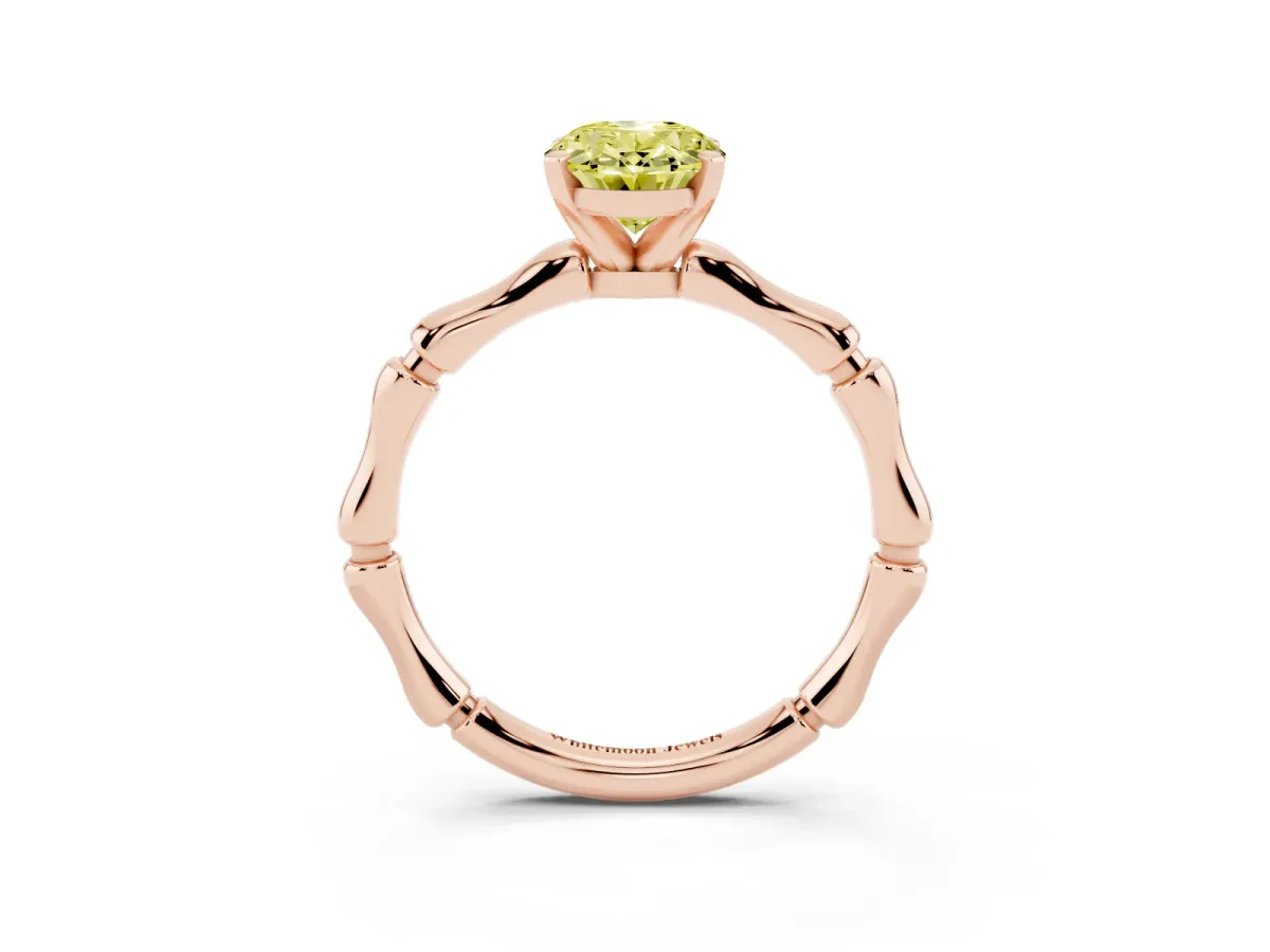 Fancy Yellow Oval Cut Solitaire Diamond Ring with Bamboo Band and Four-Prong Setting Rose gold