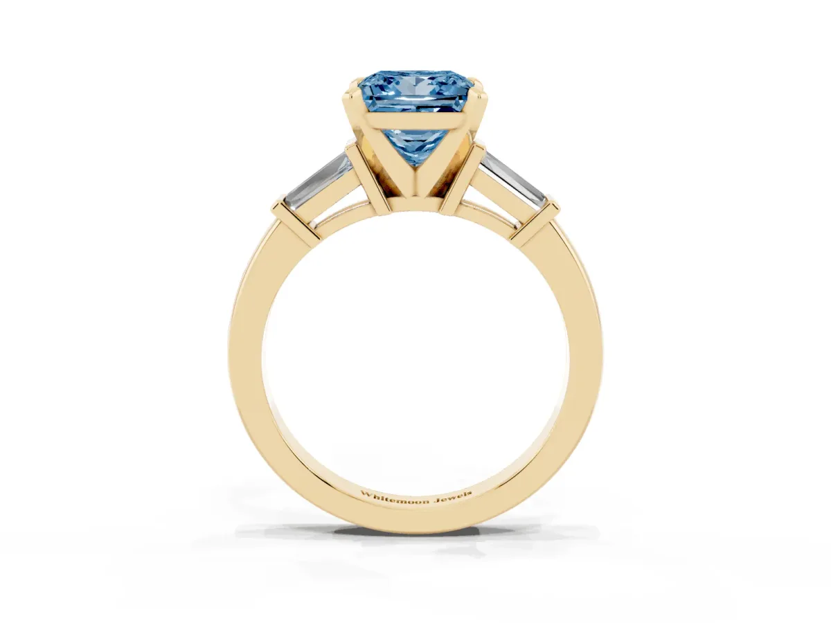 Fancy Blue Princess Cut Cut Diamond Solitaire Ring with Tapered Baguette Accents and Four-Prong Setting Yellow gold