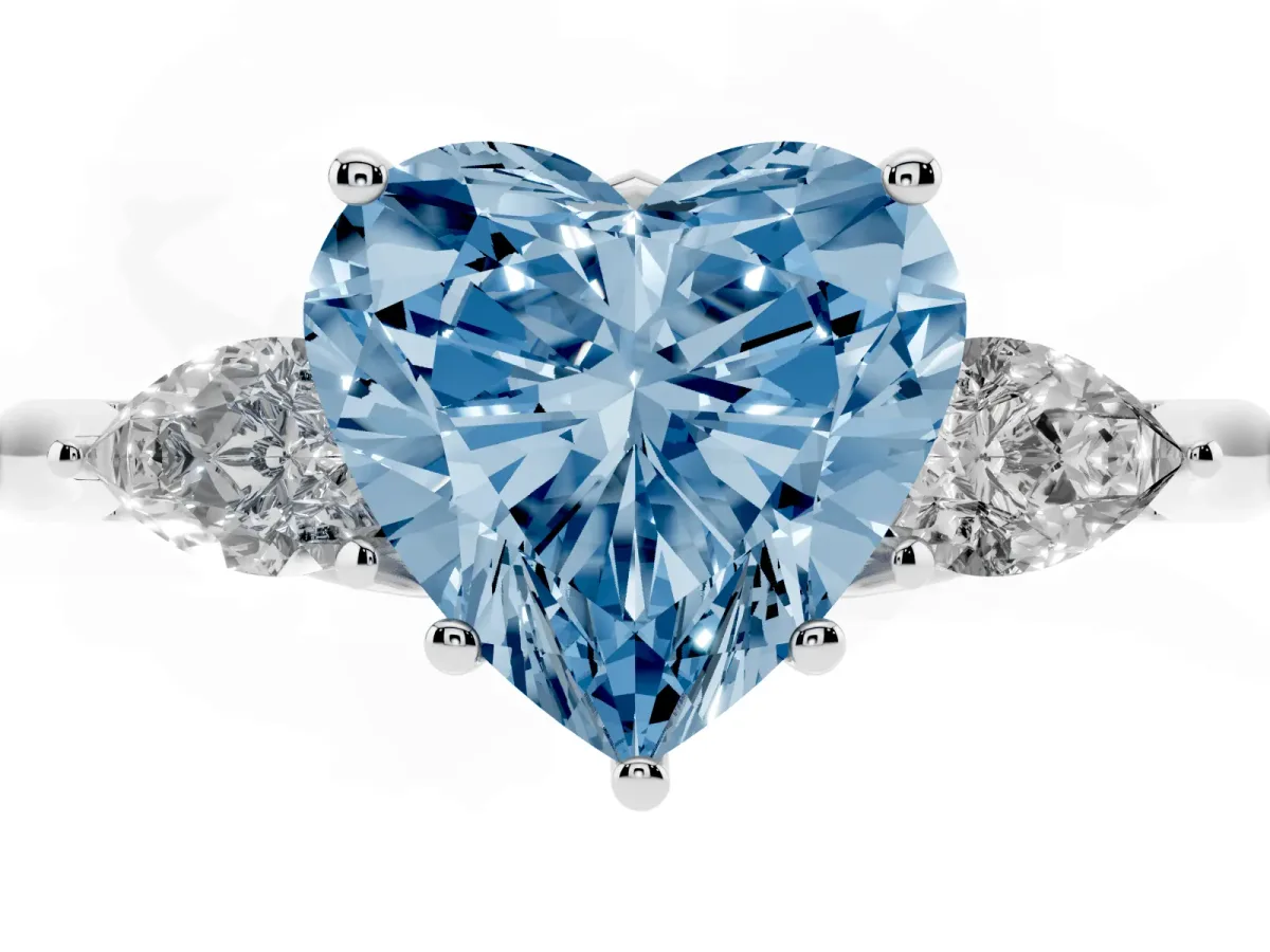 Fancy Blue Three-Stone Heart Cut Diamond Ring with Pear Side Stones in Four-Prong Setting Silver