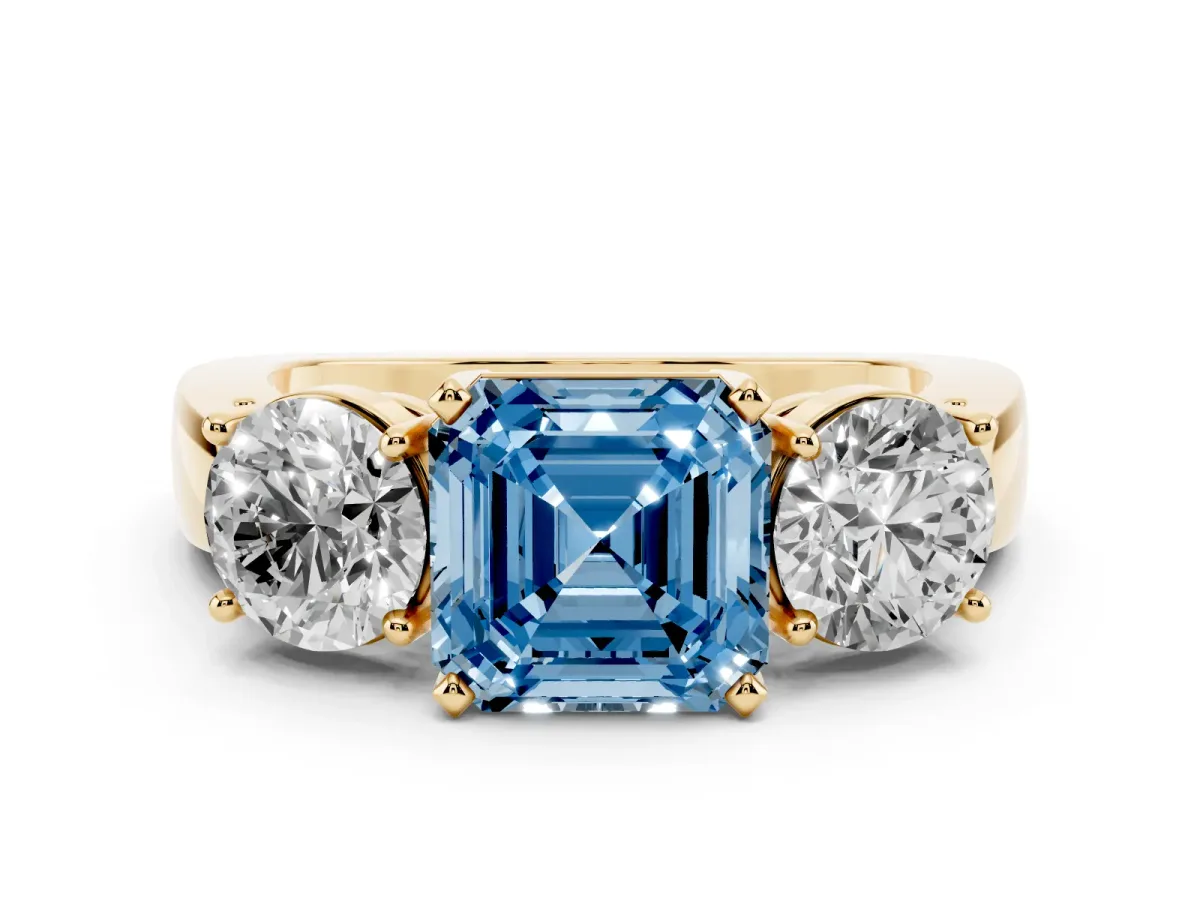 Fancy Blue Three-Stone Asscher Cut Diamond Ring with Round Side Stones, Classic Band, and Four-Prong Setting Yellow gold