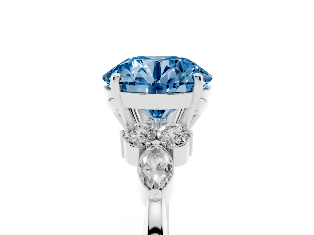 Fancy Blue Round Cut Brilliant Diamond Solitaire Ring with Pear Side Stones and Four-Prong Setting Silver