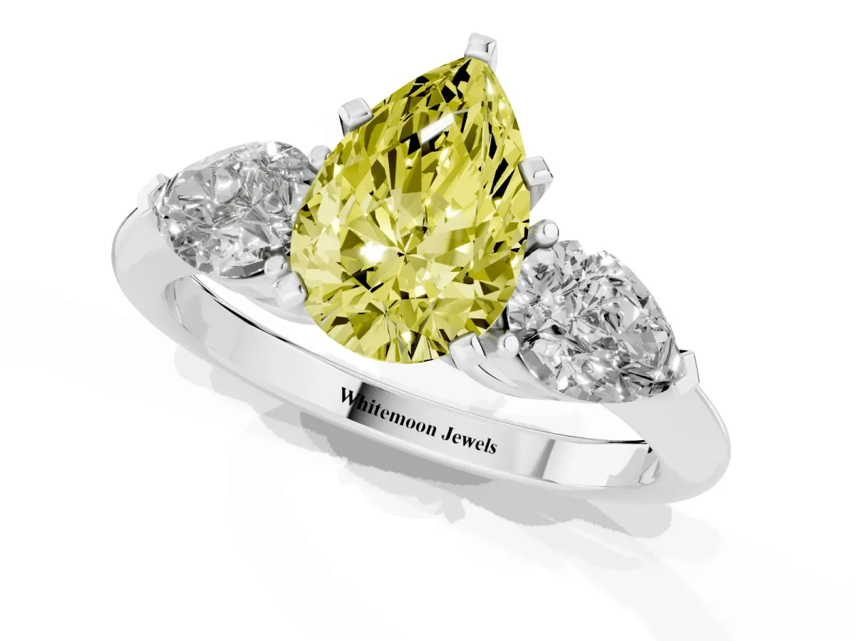 Fancy Yellow Three-Stone Pear Cut Diamond Ring with Pear Side Stones and Four-Prong Setting Silver