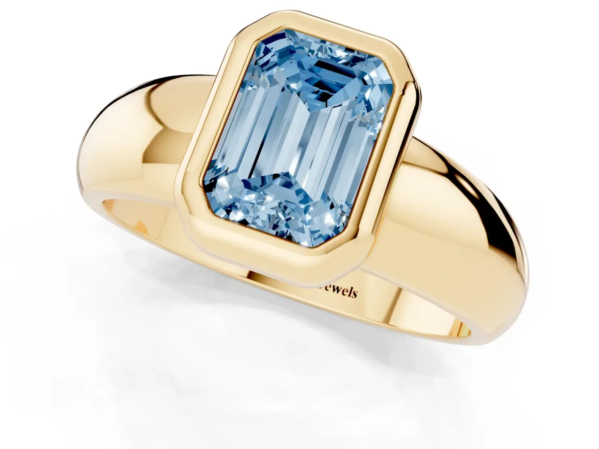 Fancy Blue Bezel Set Emerald Cut Solitaire Ring with Wide Band Yellow gold
