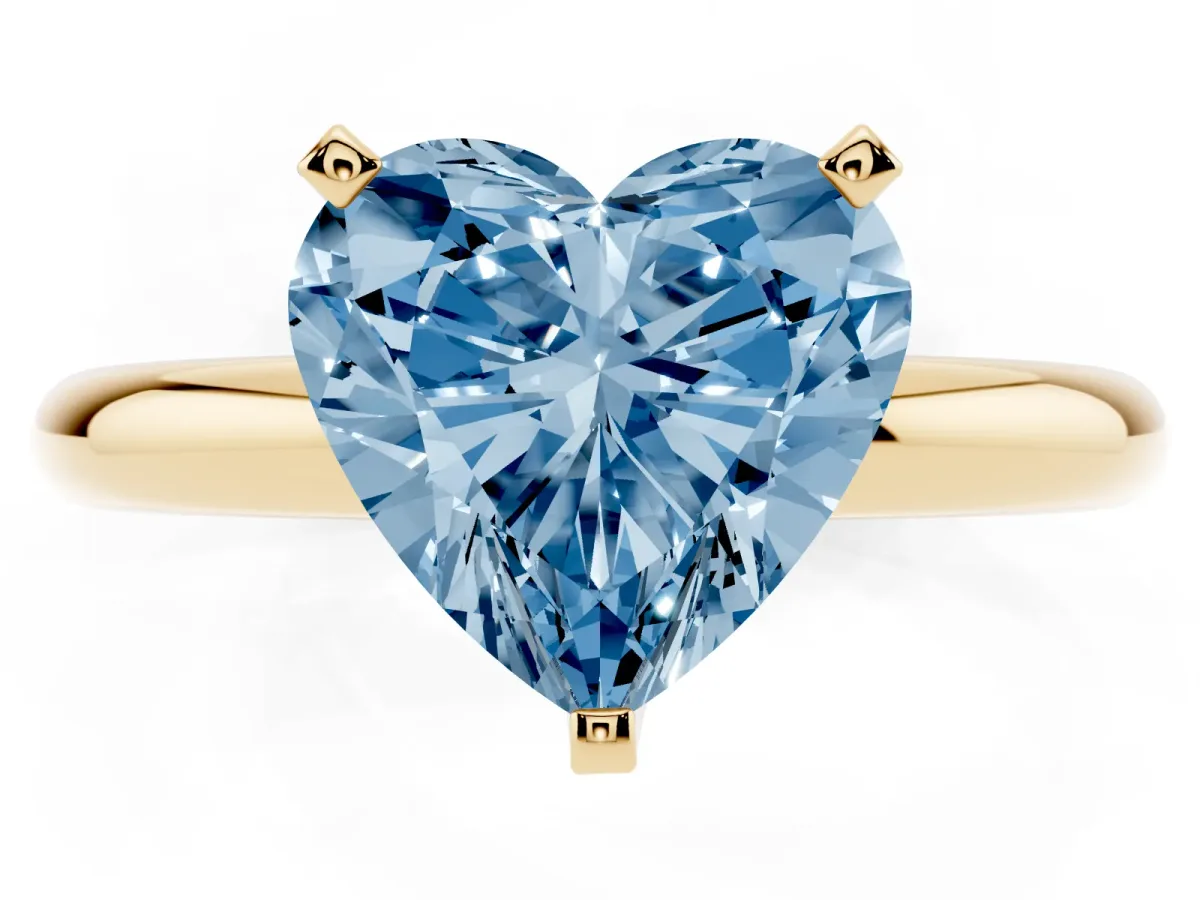 Fancy Blue Heart Cut Diamond Solitaire Engagement Ring with Round Band and Four-Prong Setting Yellow gold