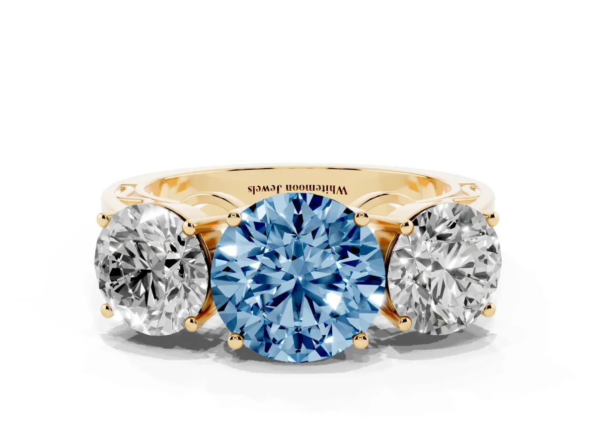 Fancy Blue Round Cut Diamond Three-Stone Ring with Prong Setting and Textured Band Yellow gold