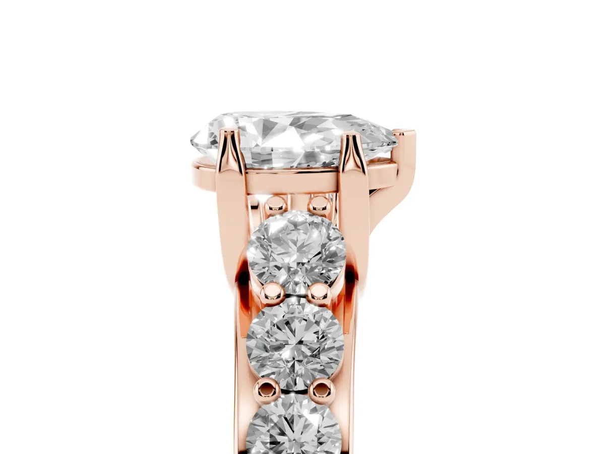 Pear Cut Diamond Engagement Ring with Pavé Band and Four-Prong Setting Rose gold