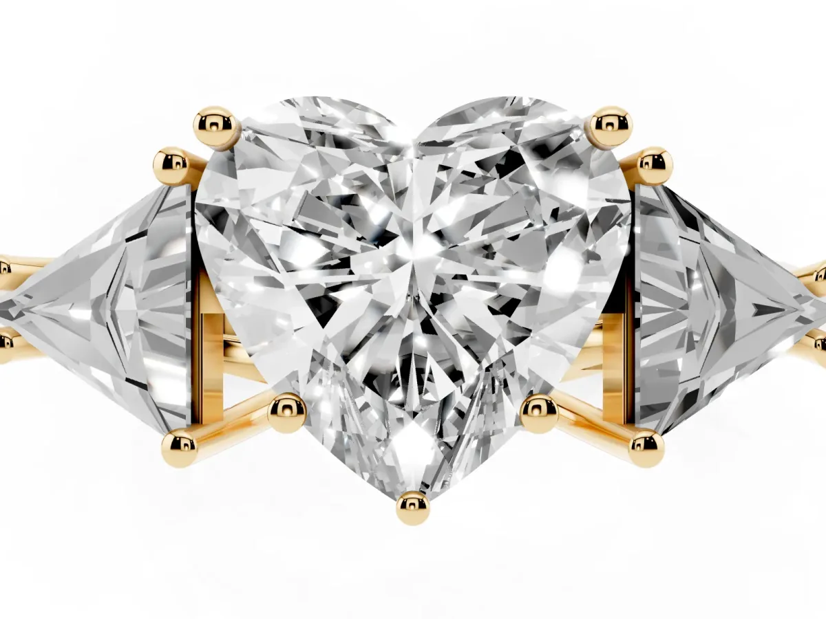 Three-Stone Heart Cut Diamond Engagement Ring with Trillion Side Stones and Prong Setting Yellow gold