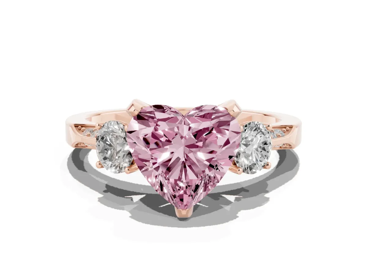 Fancy Pink Heart Cut Brilliant Three-Stone Diamond Ring with Pavé Band and Four-Prong Setting Rose gold