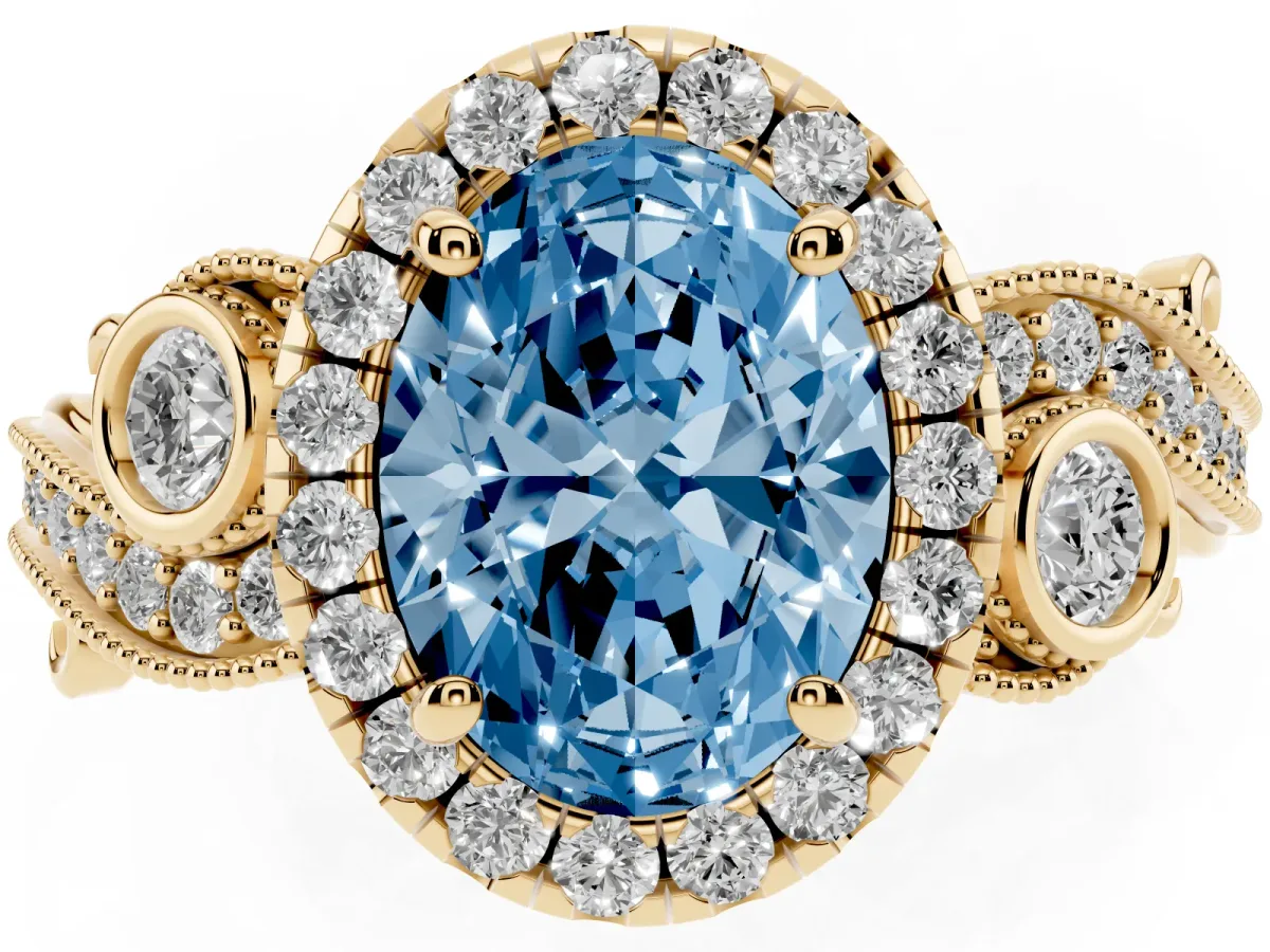 Fancy Blue Oval Cut Halo Diamond Ring with Milgrain and Bezel Accents on a Split Shank Band Yellow gold