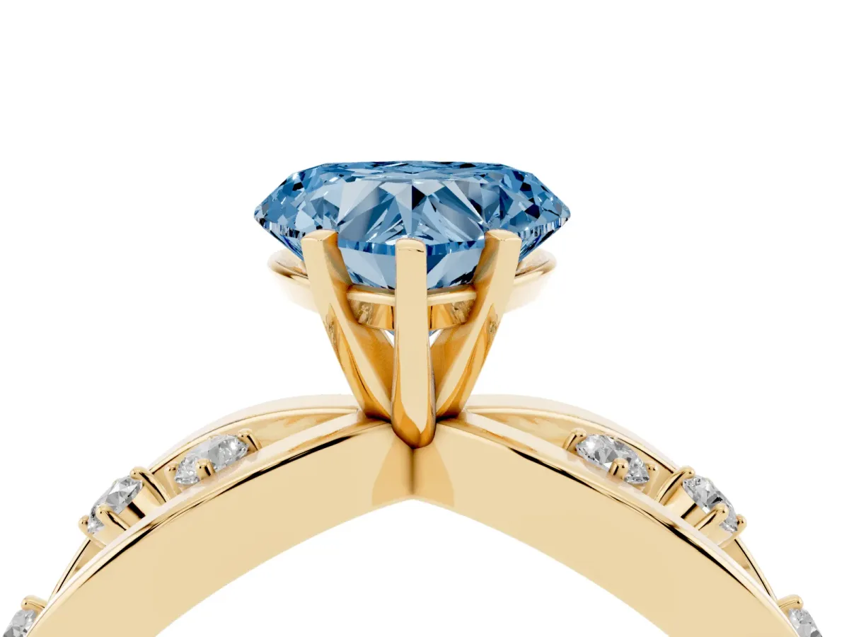 Fancy Blue Heart Cut Cut Solitaire Diamond with Side Stones on Criss-Cross Band and Four-Prong Setting Yellow gold