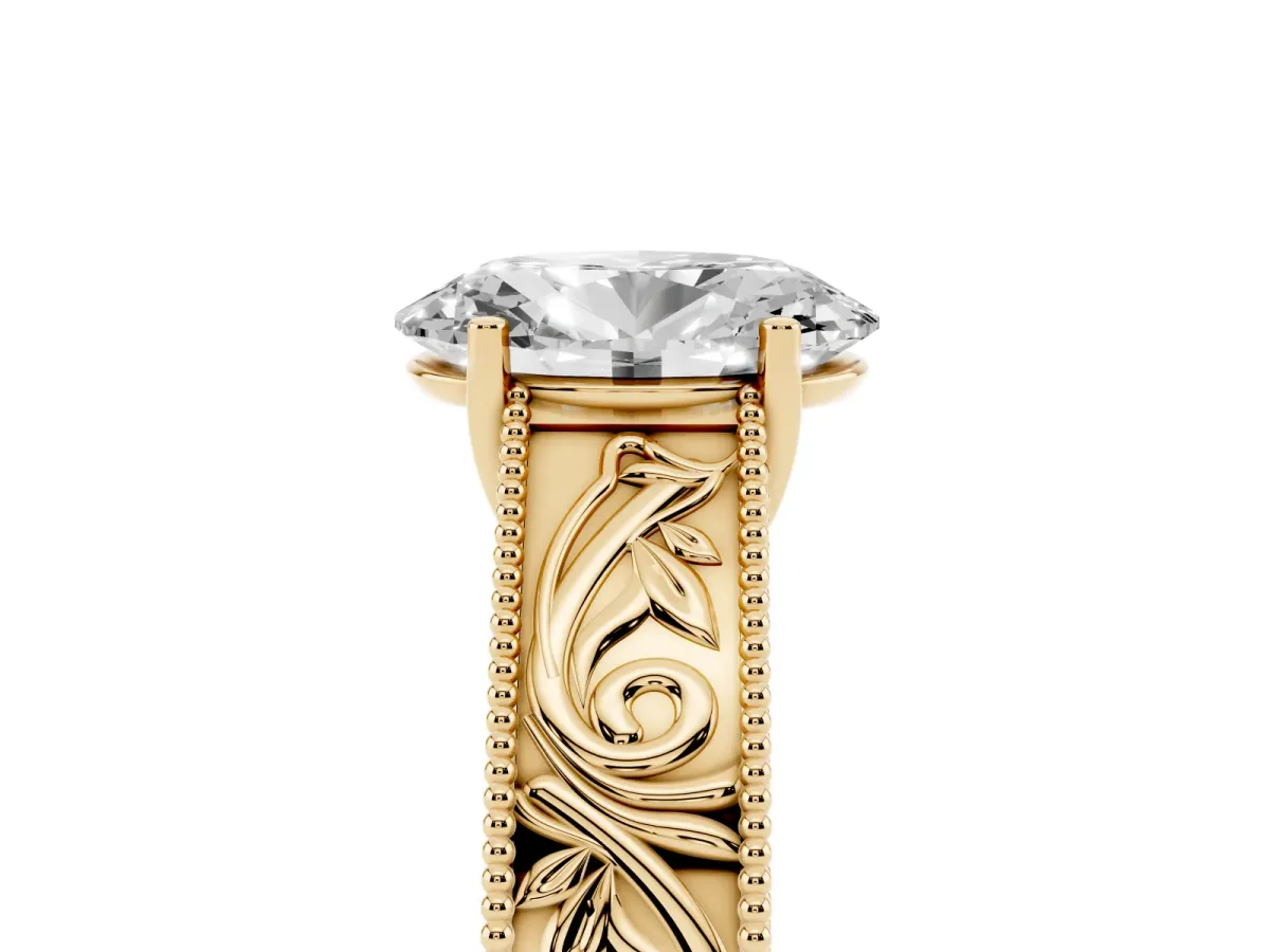 Oval Cut Diamond Solitaire Ring with Engraved Band and Four-Prong Setting Yellow gold