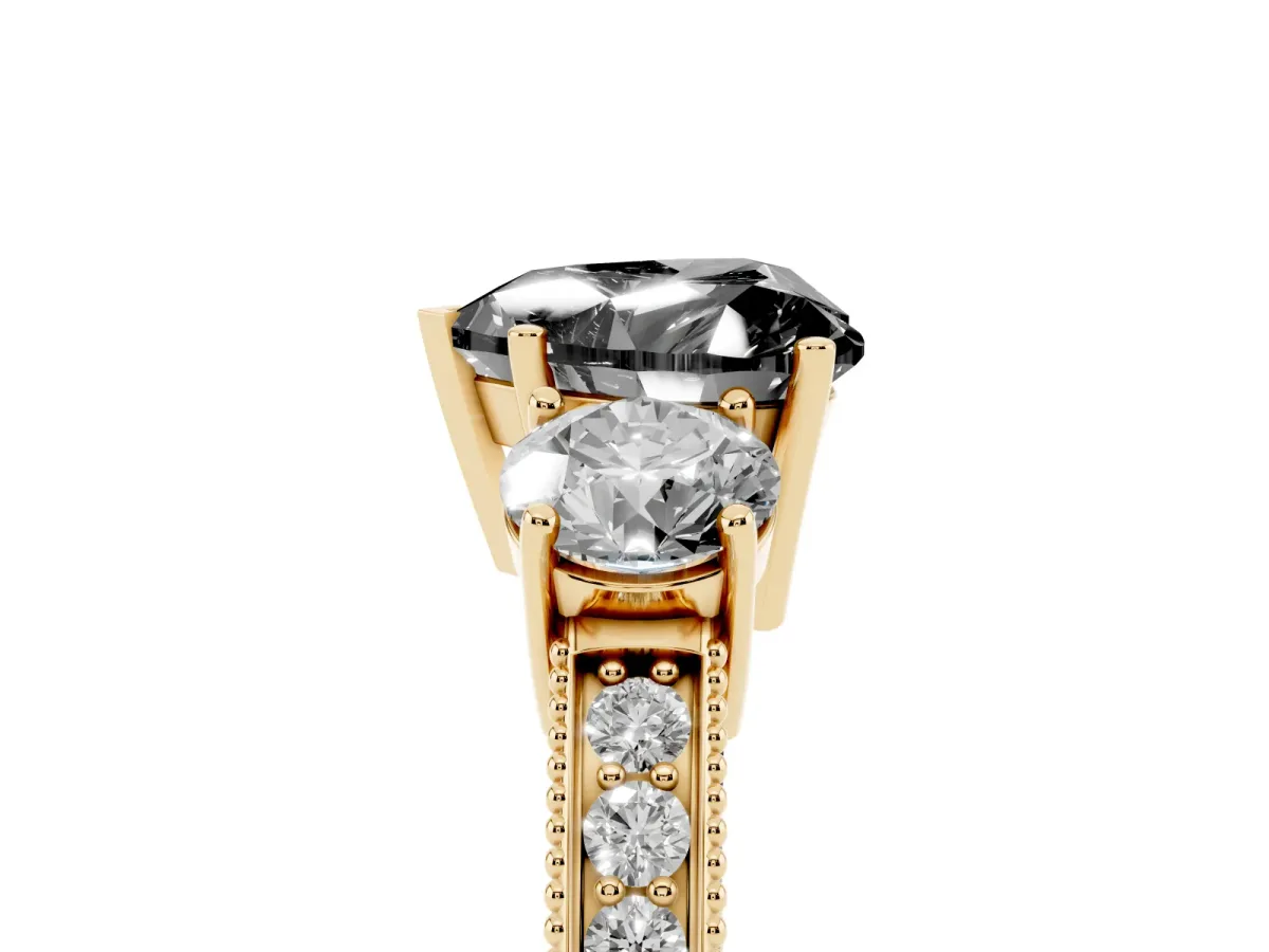 Fancy Black Heart Cut Three-Stone Diamond Ring with Pavé Band and Four-Prong Setting Yellow gold