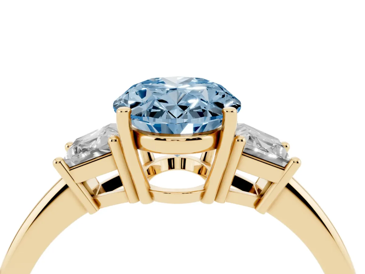 Fancy Blue Oval Cut Diamond Three-Stone Ring with Trapezoid Side Stones and Prong Setting Yellow gold