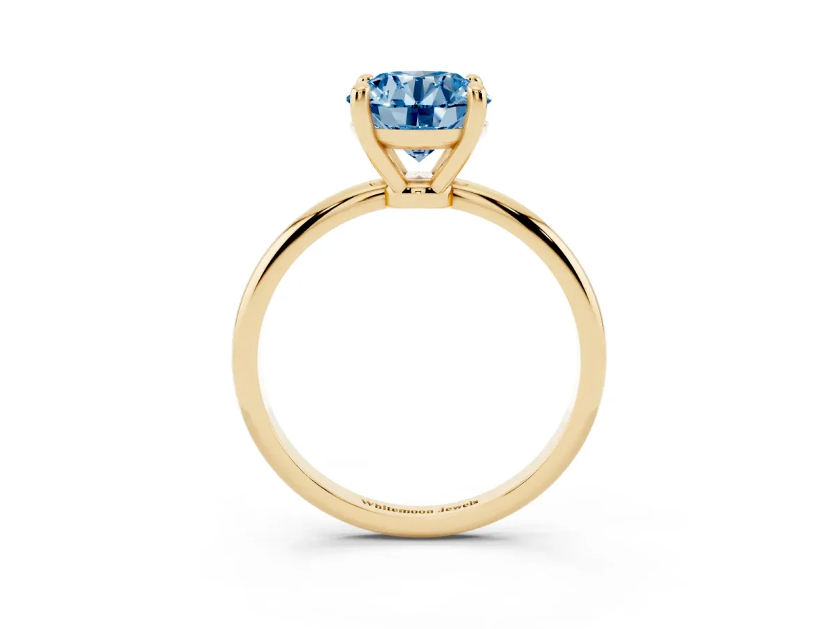 Fancy Blue Round Cut Solitaire Diamond Ring with 4-Prong Setting on a Classic Band Yellow gold