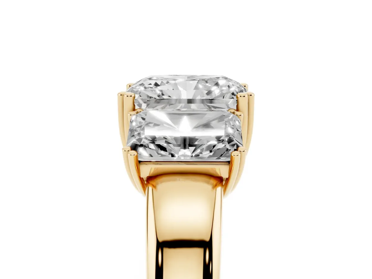 Three-Stone Radiant Cut Cut Diamond Ring with Channel Set Band and Four-Prong Setting Yellow gold