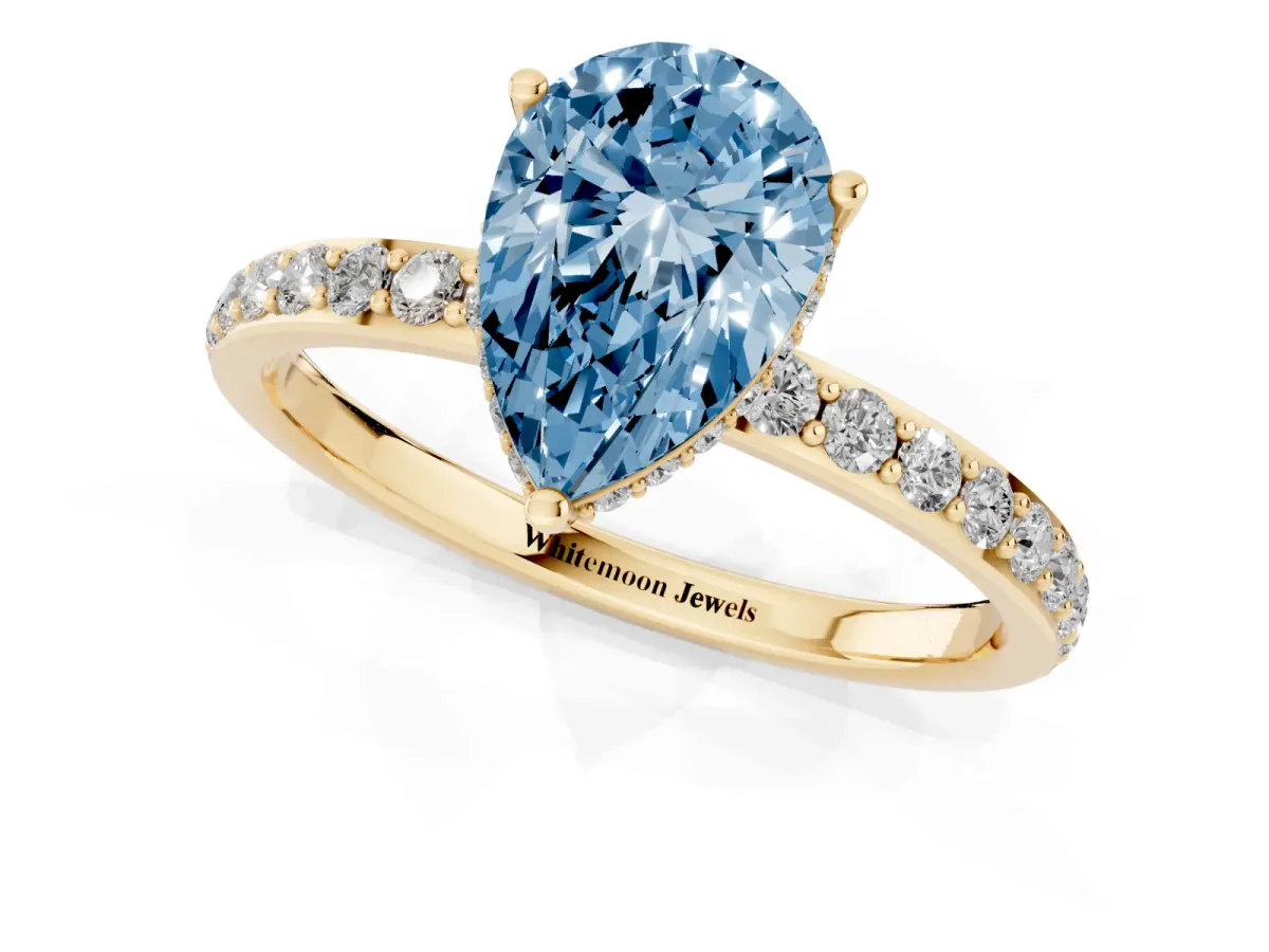 Fancy Blue Pear Cut Diamond Solitaire Ring with Pavé Band and Hidden Halo Yellow gold