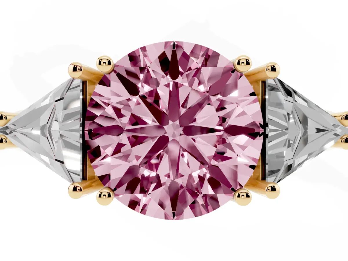 Fancy Pink Three-Stone Round Cut Diamond Engagement Ring with Trillion Side Stones and Prong Setting Yellow gold