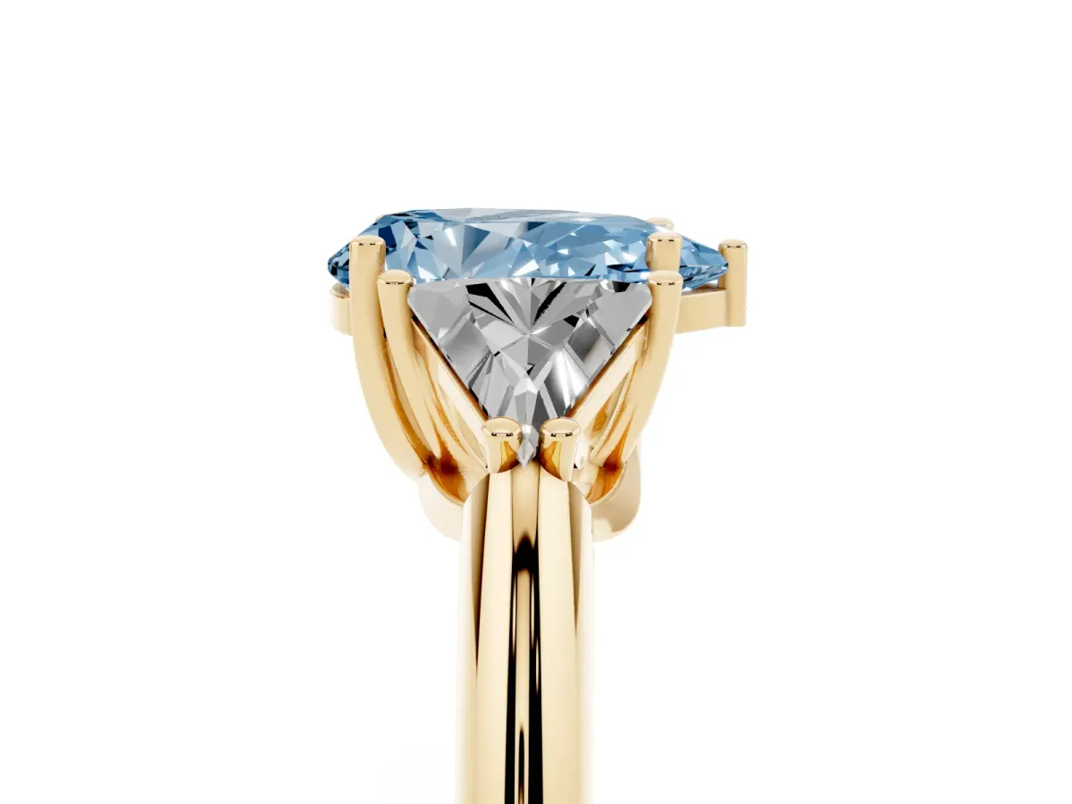Fancy Blue Three-Stone Pear Cut Diamond Engagement Ring with Trillion Side Stones and Prong Setting Yellow gold