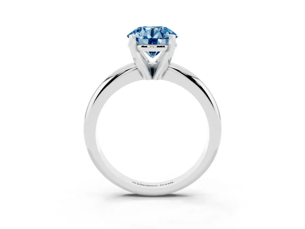 Fancy Blue Round Cut Diamond Solitaire Engagement Ring with Round Band and Four-Prong Setting Silver