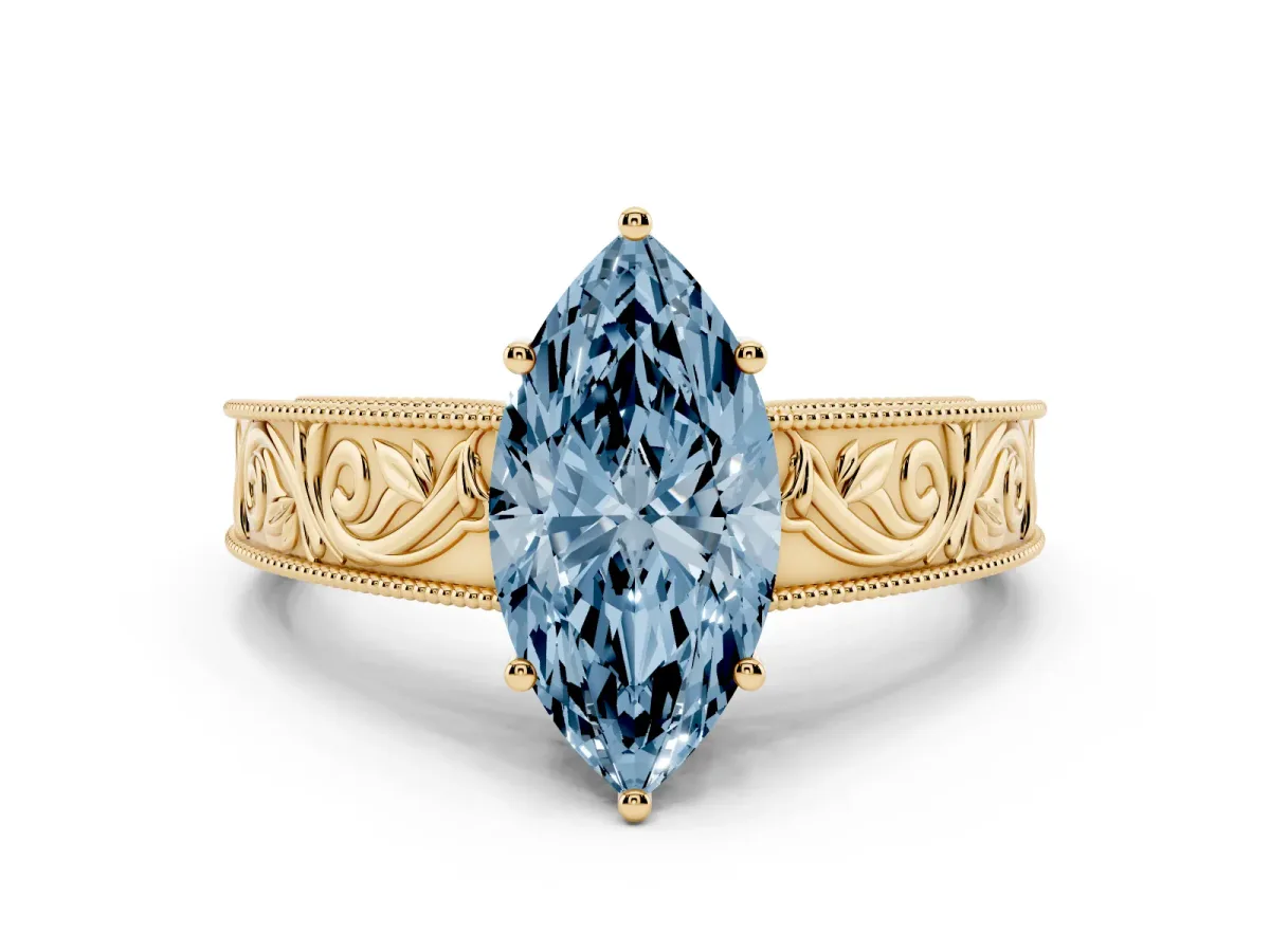 Fancy Blue Marquise Cut Diamond Solitaire Ring with Engraved Band and Four-Prong Setting Yellow gold